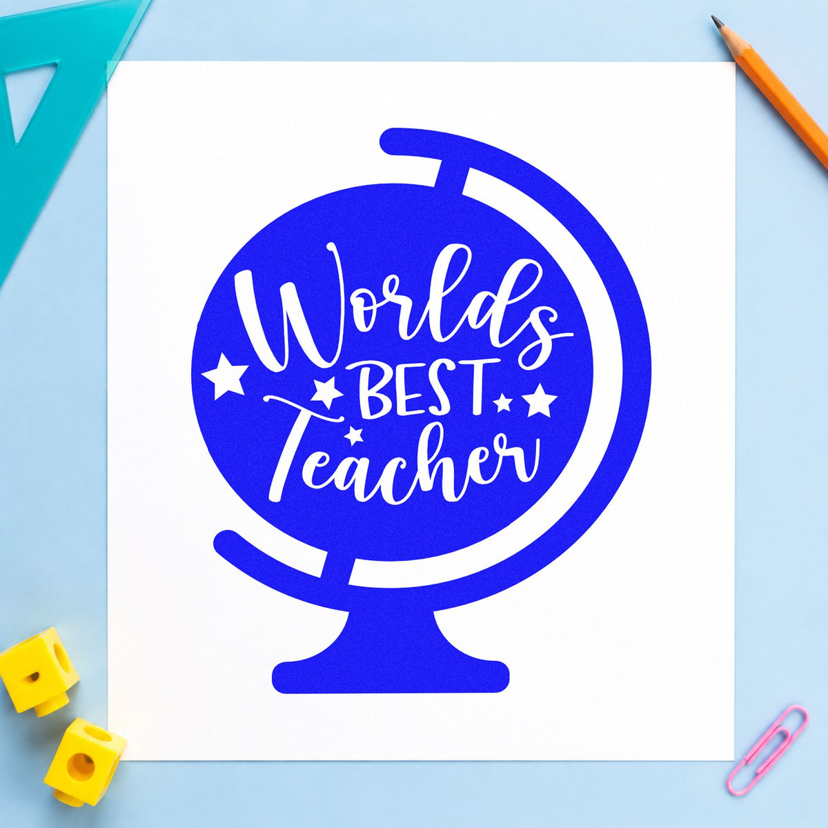 World's Best Teacher Tilted Globe craft stamp imprinted in blue ink on paper, a design suited to gift wrap seals.