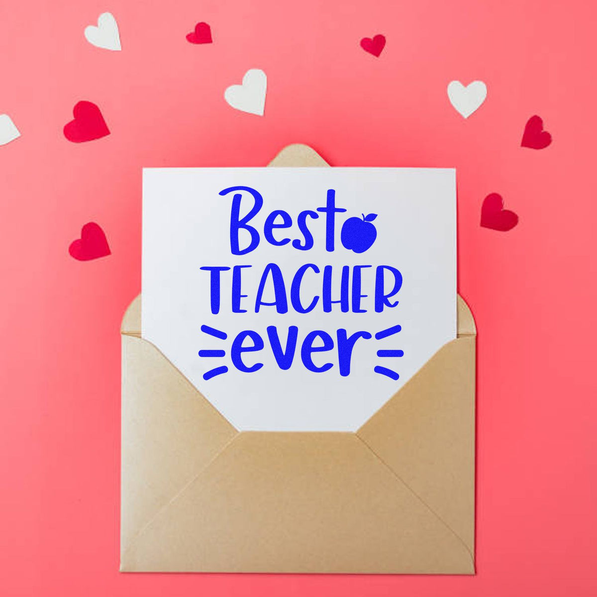 Blue Best Teacher Ever stamp and seal on a beige envelope, with red and white hearts on a pink background.