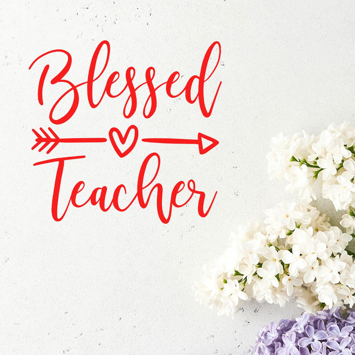 Red Blessed Teacher stamp design with heart arrow on white background, accented by white and purple flowers.
