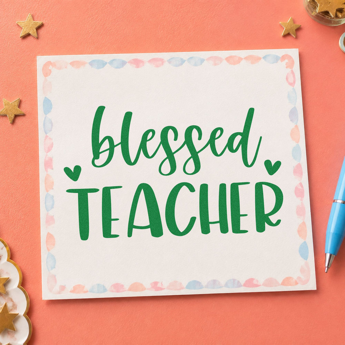 Blessed Teacher Hearts craft stamp imprint in green ink on a handmade project, one idea being blank note pages.