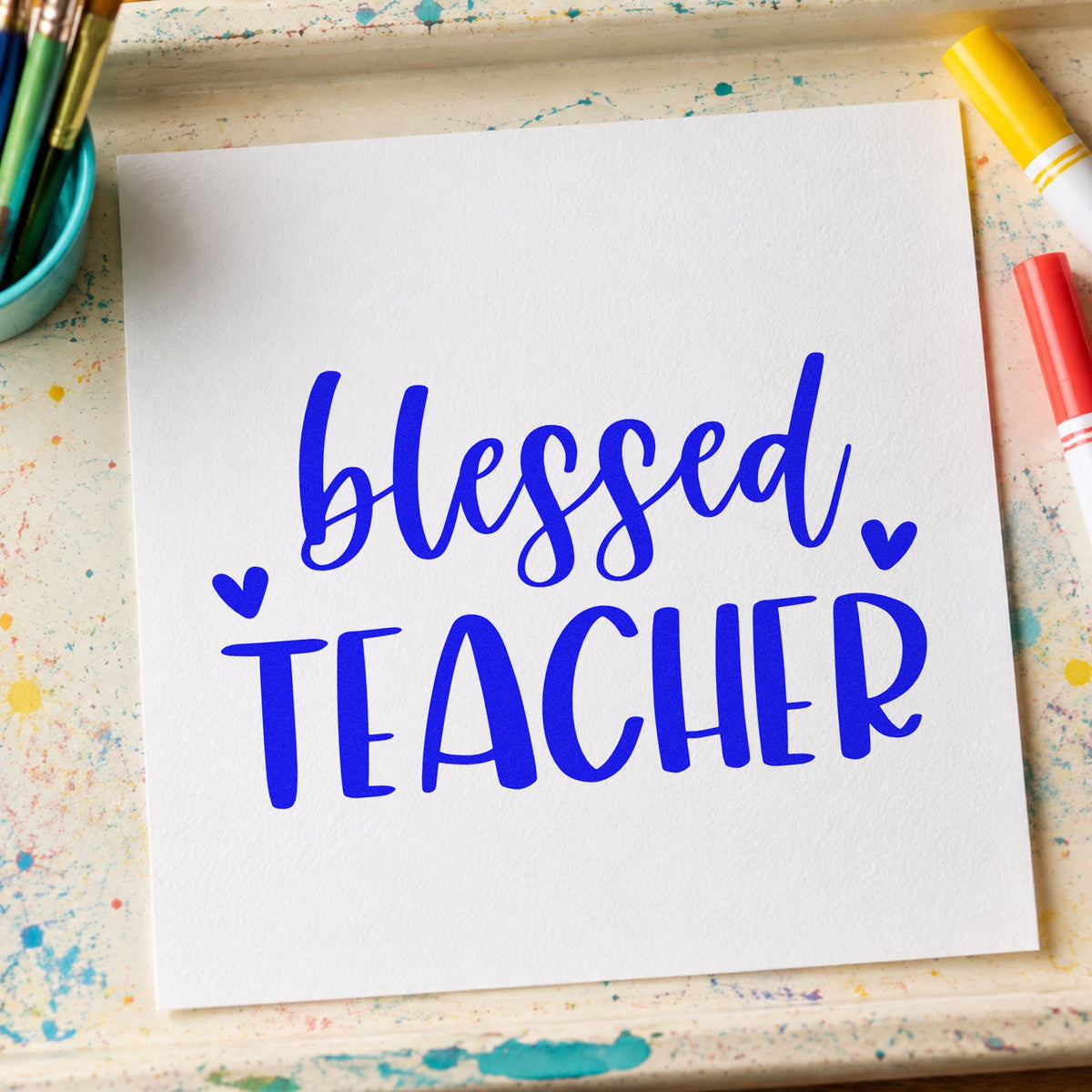 Blessed Teacher Hearts craft stamp in blue ink on cardstock, an easy option for ribbon trim panels.