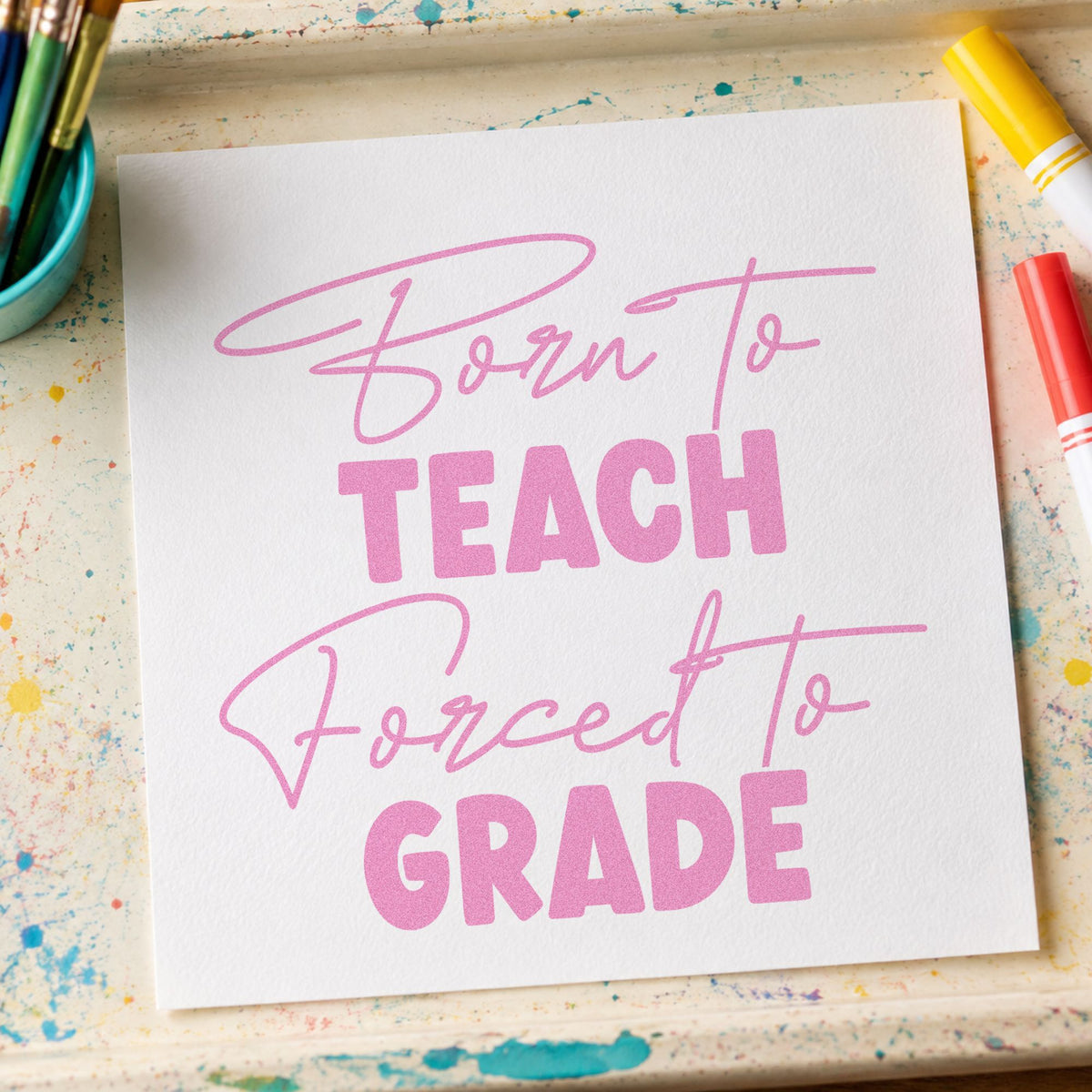 Born to Teach Forced to Grade craft stamp in purple ink on cardstock, an easy option for marking box tags.