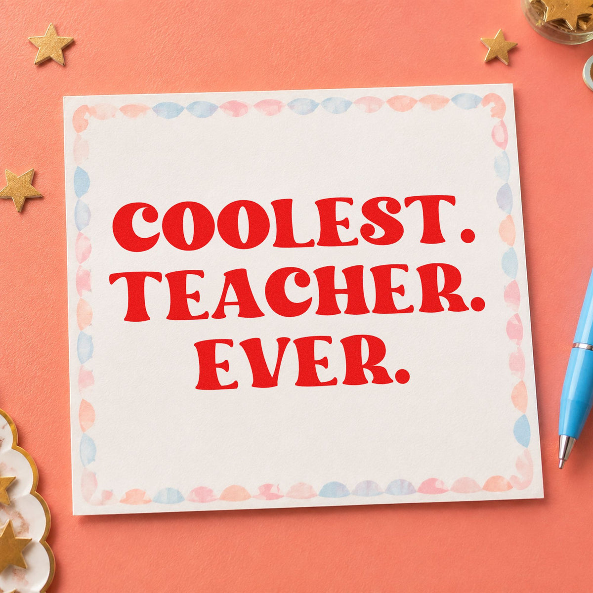 Coolest Teacher Ever rubber stamp shown in red ink, stamped for projects such as prize giving notes.