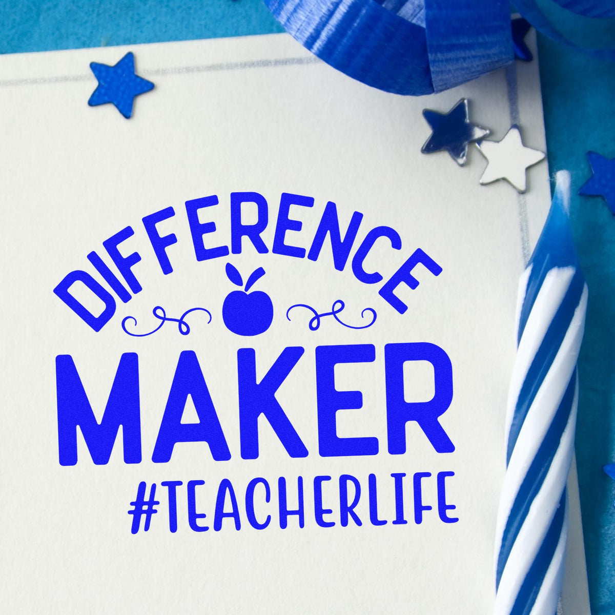 Blue Difference Maker teacher-life stamp and seal on white card, with stars and apple icon, on blue background.