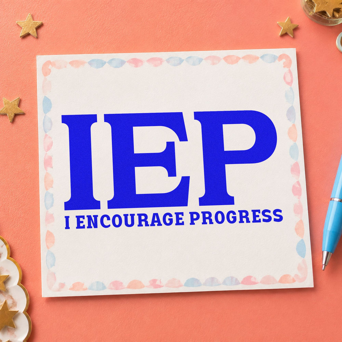 IEP I Encourage Progress craft stamp imprinted in blue ink on paper, a design suited to report wallet seals.