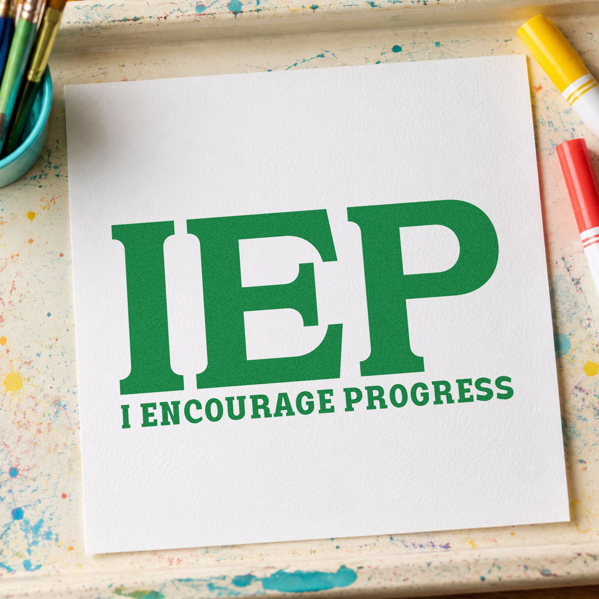 IEP I Encourage Progress craft stamp imprint in green ink on a handmade project, one idea being framed support room.