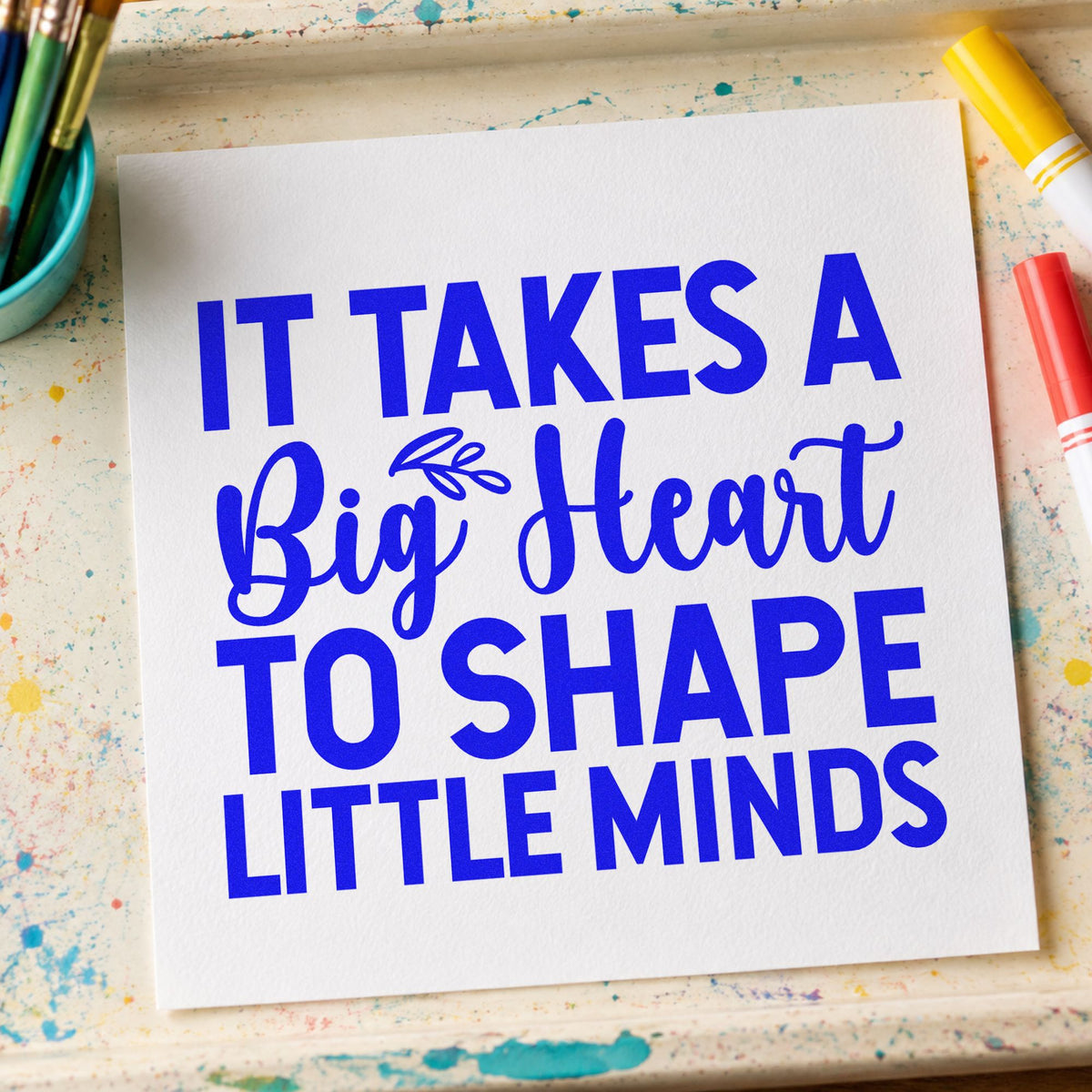 Big Heart Little Minds craft stamp in blue ink on cardstock, an easy option for story cushion panels.