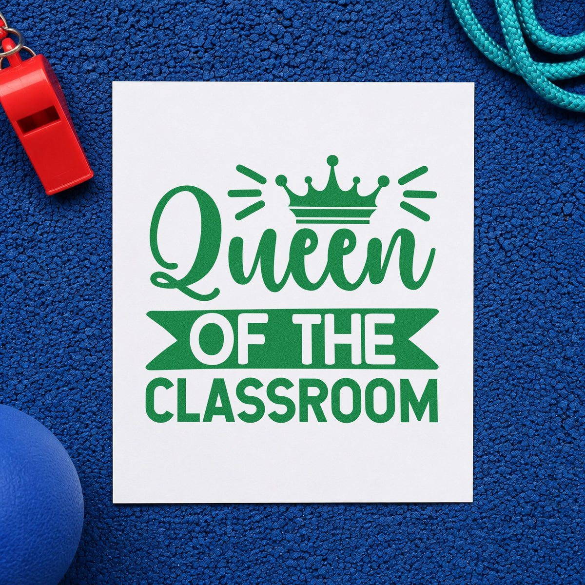 Queen Of The Classroom craft stamp imprint in green ink on a handmade project, one idea being seating plan pages.