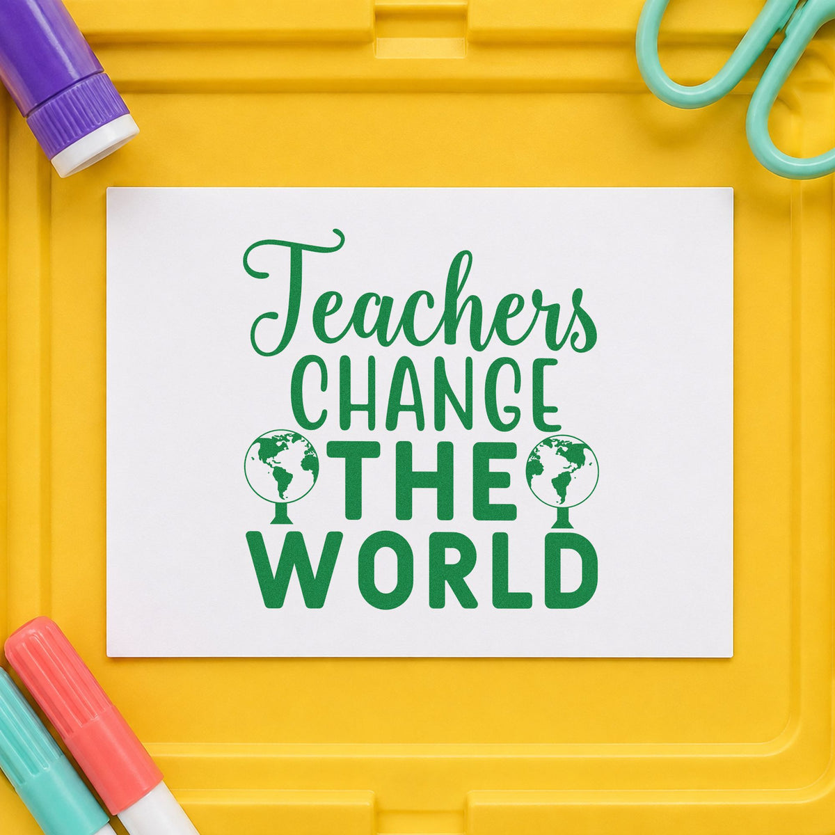Teachers Change The World craft stamp imprint in green ink on a handmade project, one idea being pen pal pages.