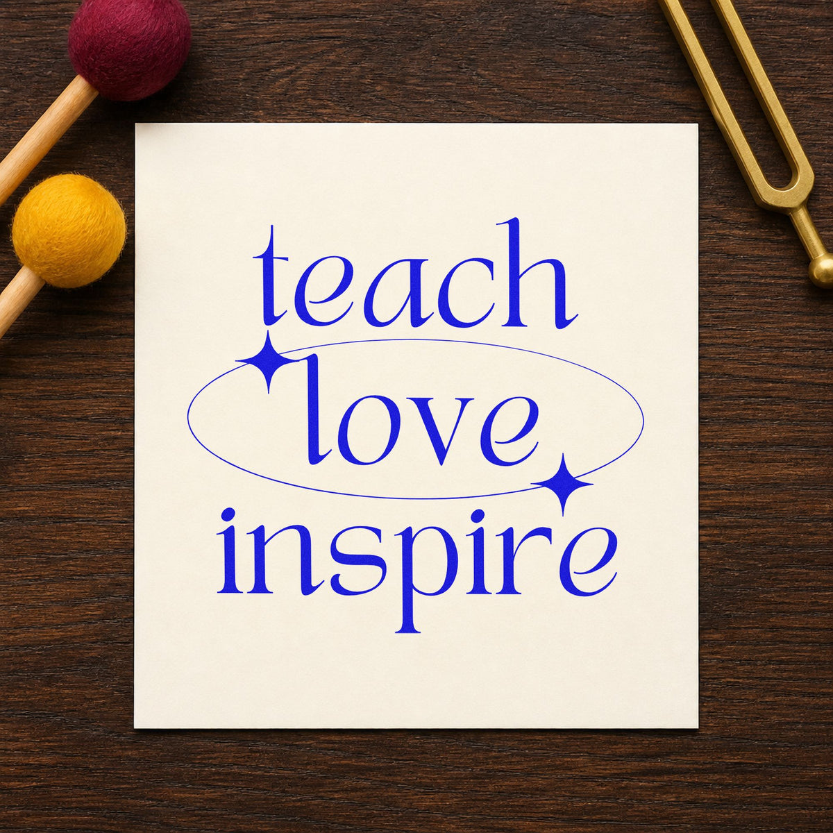 Teach Love Inspire Orbit craft stamp imprinted in blue ink on paper, a design suited to safety sheet seals.