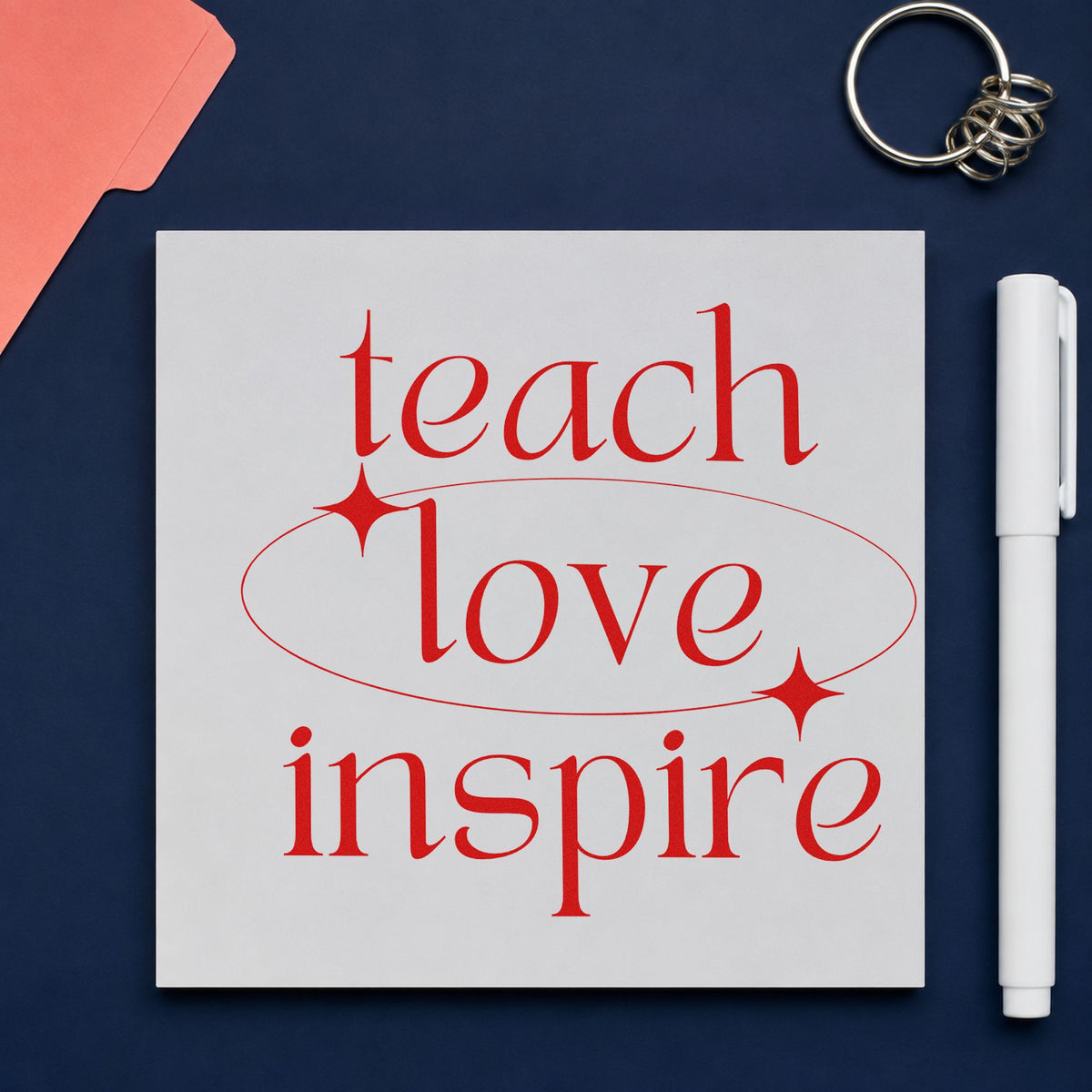 Teach Love Inspire Orbit rubber stamp shown in red ink, stamped for projects such as science week notes.