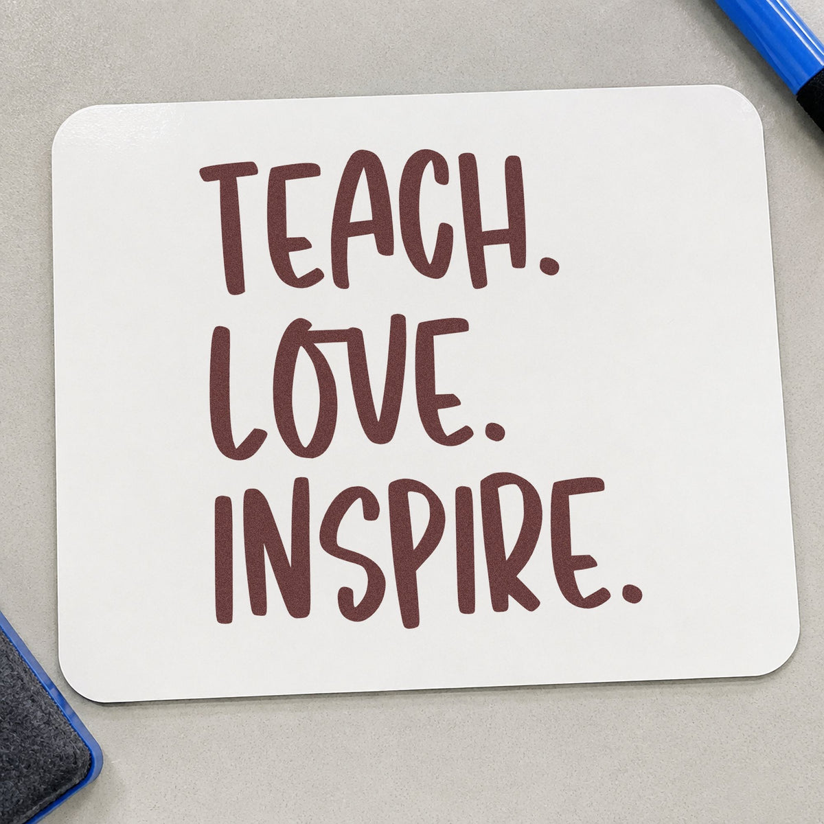 Teach Love Inspire Capitals rubber stamp printed in brown ink, ready for ink pot labels and similar paper crafts.