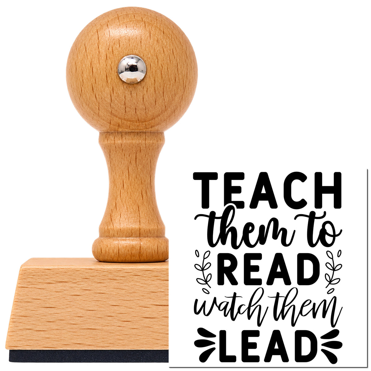 Vintage Pro beech wood stamp with a round knob handle, shown with its black Teach Them To Read Watch Them Lead imprint on white.
