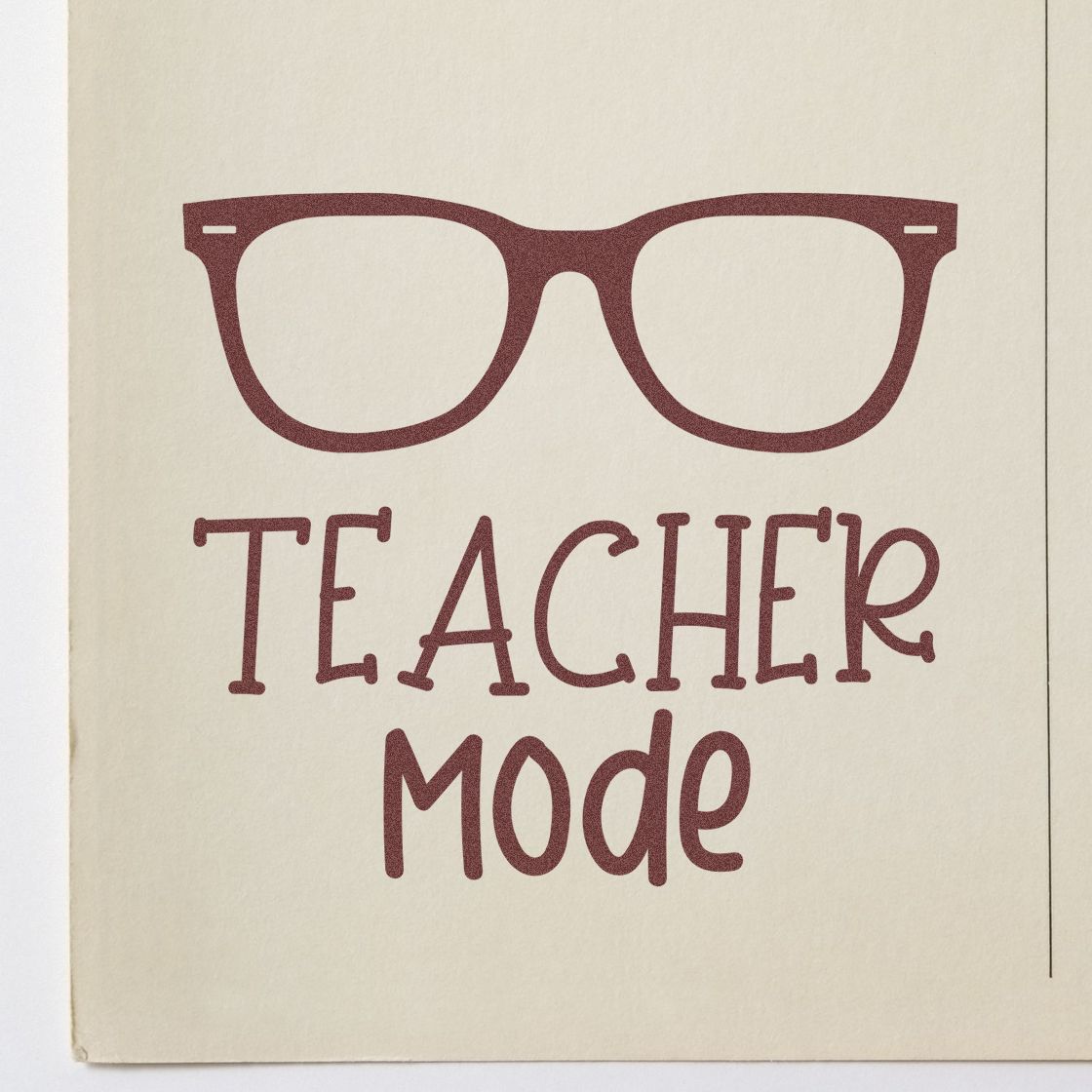 Burgundy Teacher Mode stamp/seal with eyeglasses icon on cream paper