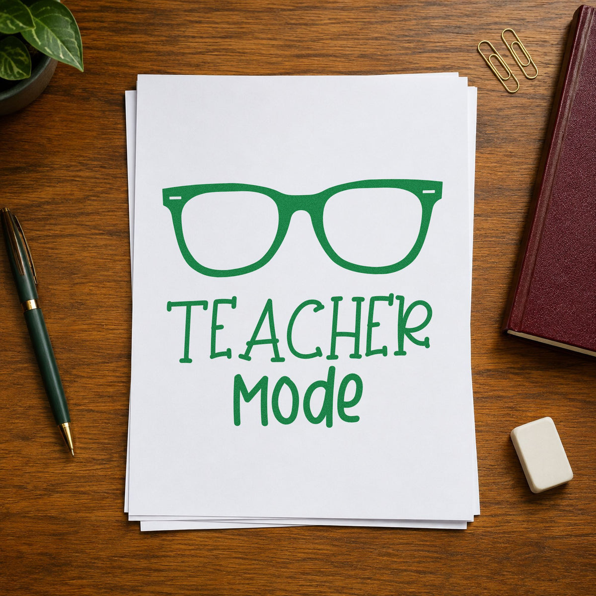 Teacher Mode Eyeglasses craft stamp imprint in green ink on a handmade project, one idea being eye test pages.