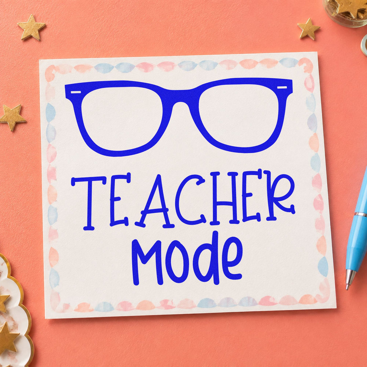 Teacher Mode Eyeglasses craft stamp in blue ink on cardstock, an easy option for case lining panels.