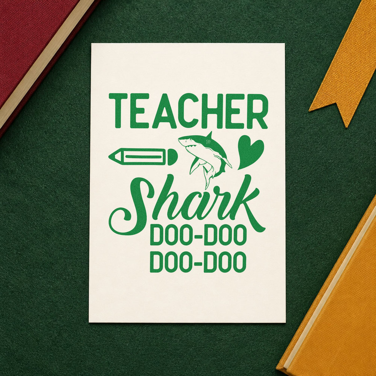 Teacher Shark Doo Doo craft stamp imprint in green ink on a handmade project, one idea being music lyric pages.