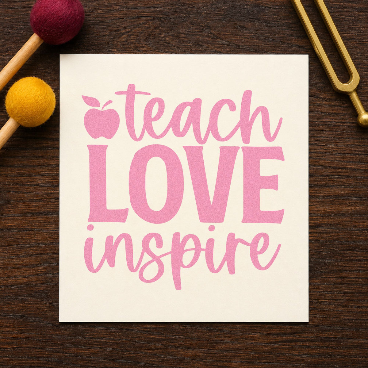 Teach Love Inspire Apple craft stamp in purple ink on cardstock, an easy option for bridal shower tags.