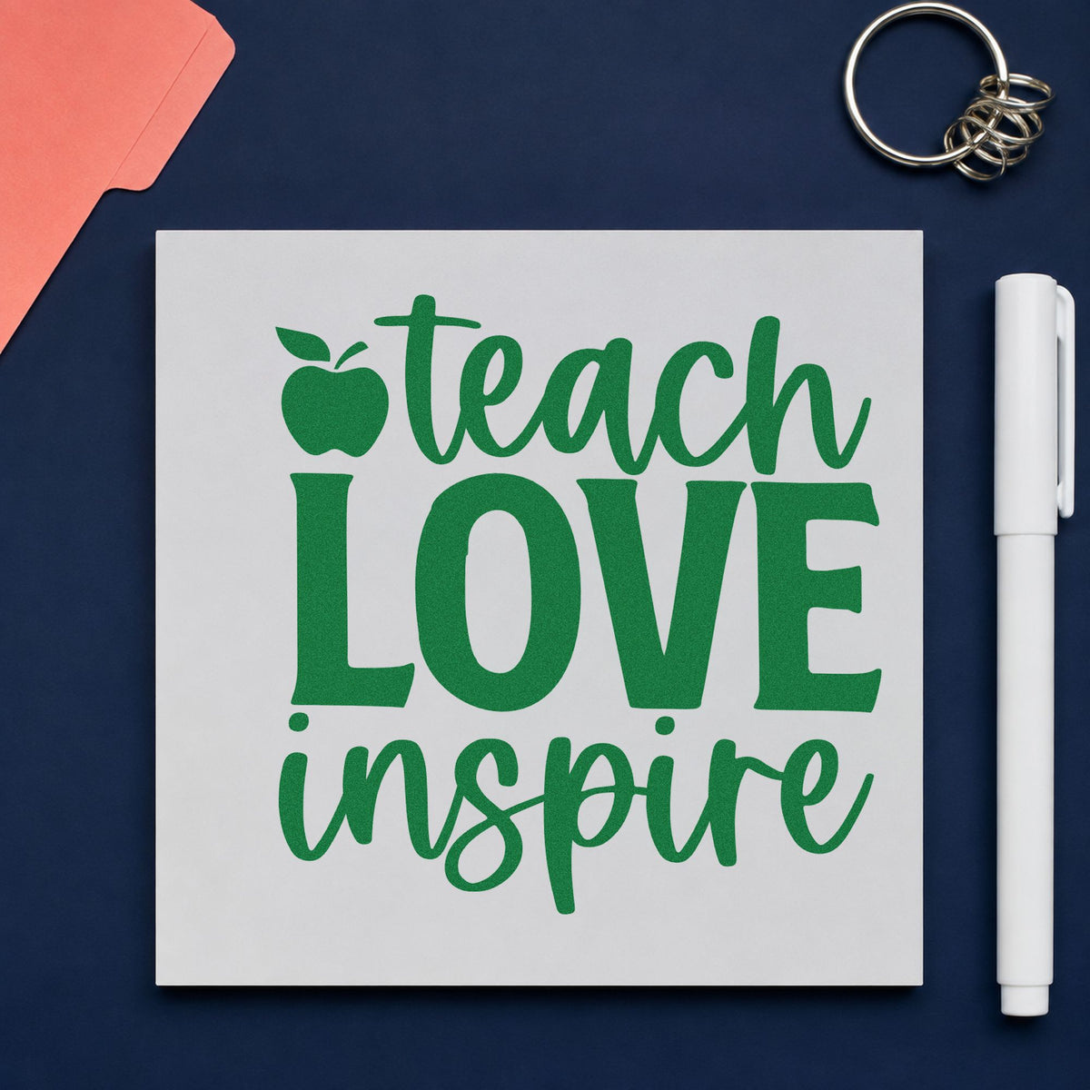 Teach Love Inspire Apple craft stamp imprint in green ink on a handmade project, one idea being guest book pages.