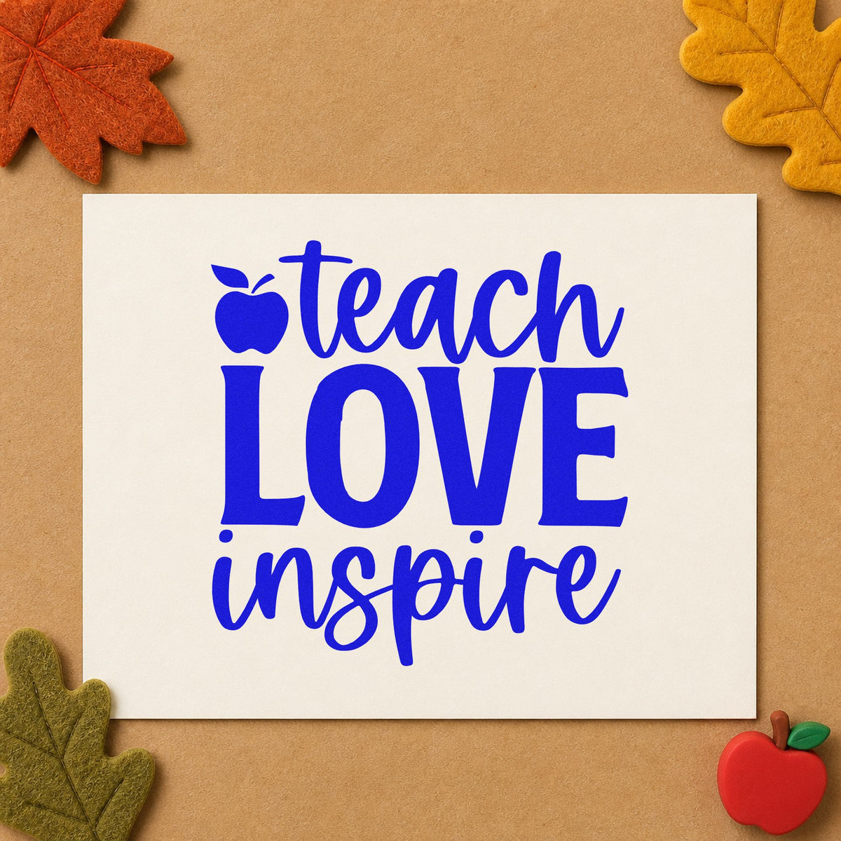Teach Love Inspire Apple craft stamp in blue ink on cardstock, an easy option for table runner panels.