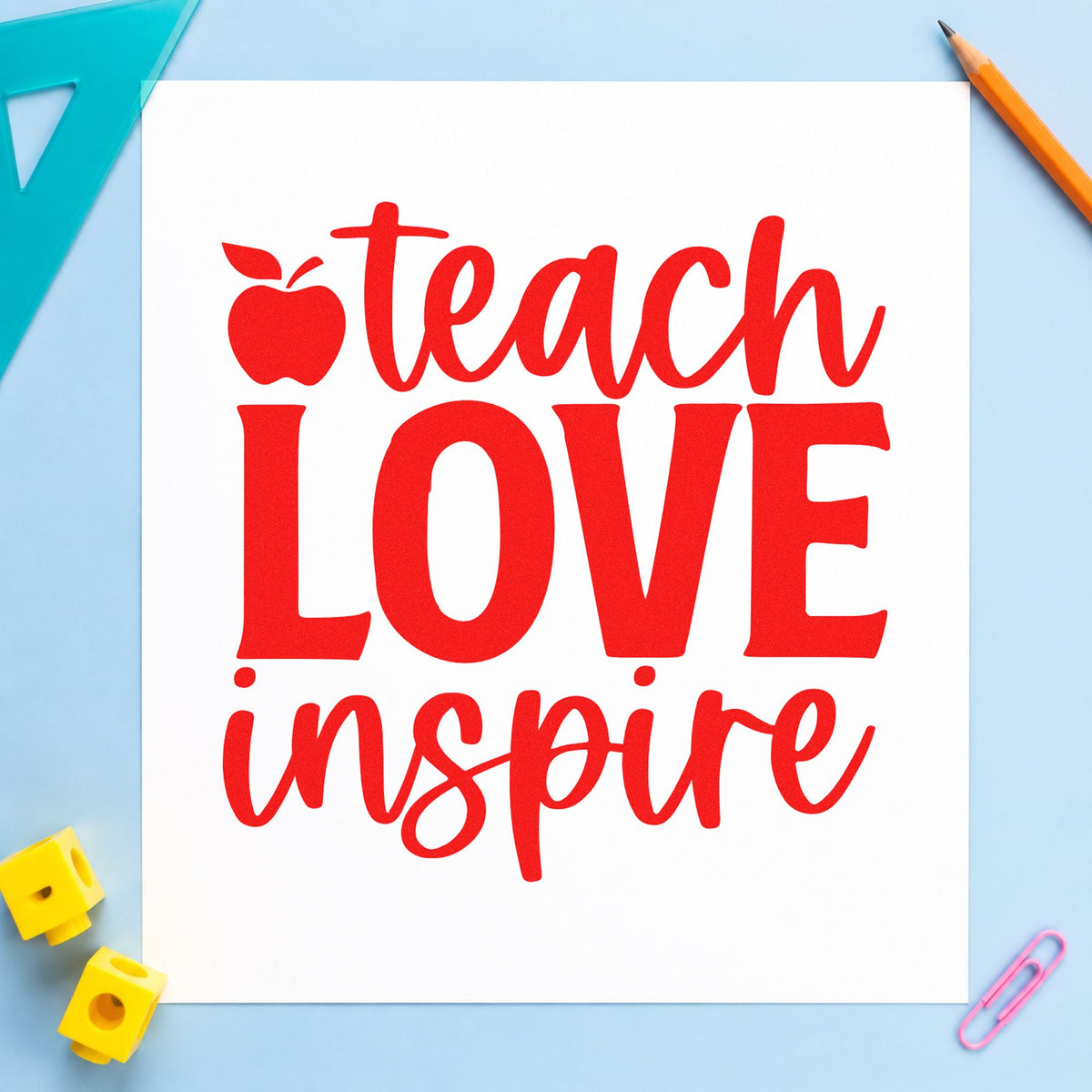 Teach Love Inspire Apple rubber stamp shown in red ink, stamped for projects such as engagement notes.