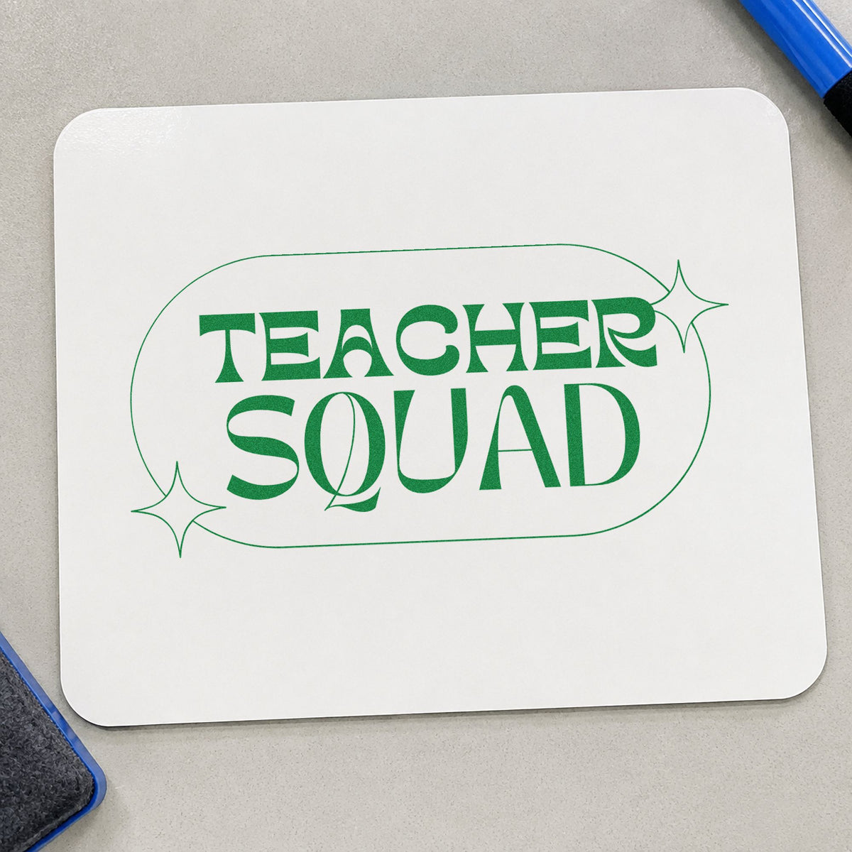 Teacher Squad Sparkle Capsule craft stamp imprint in green ink on a handmade project, one idea being framed break wall.