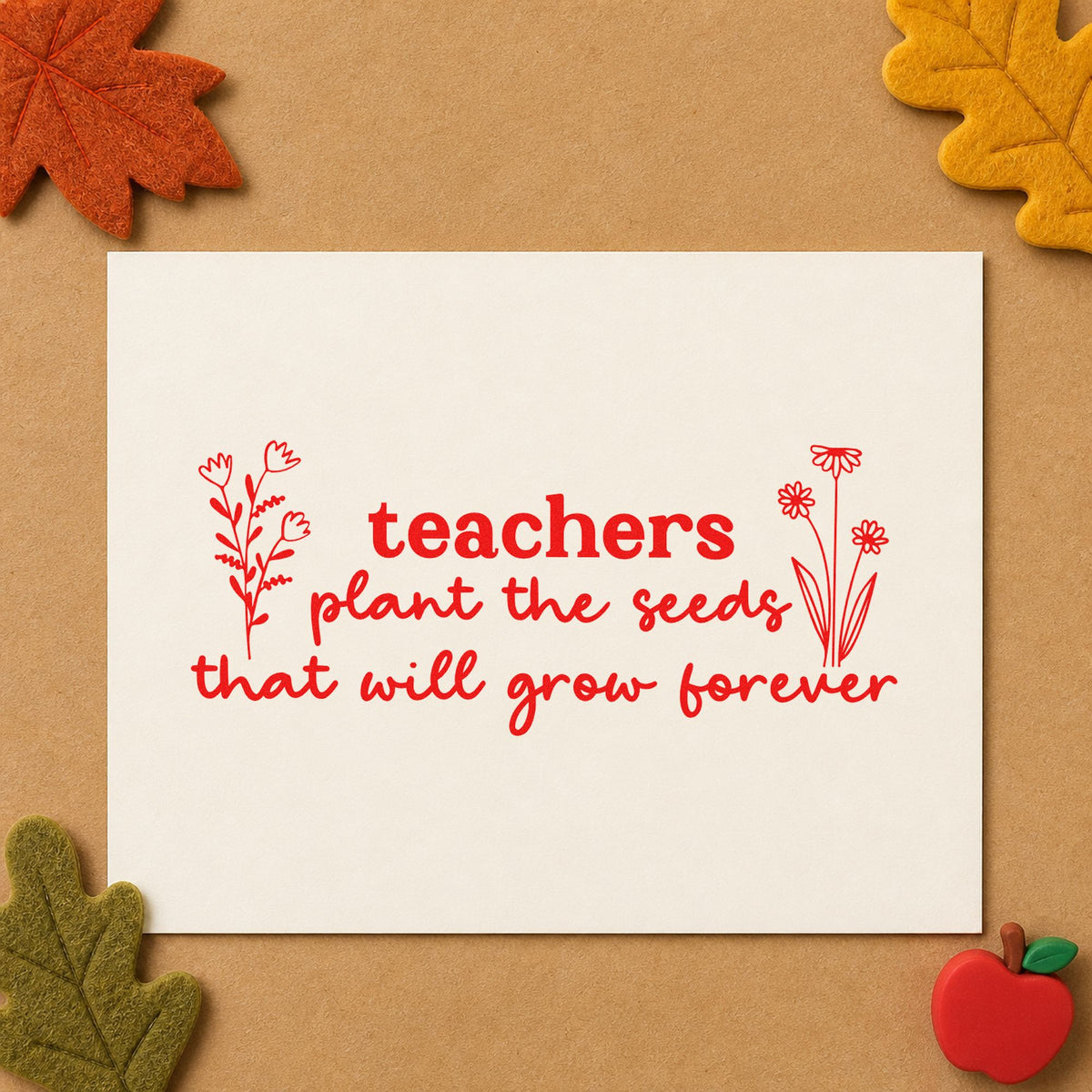 Teachers Plant Seeds Forever rubber stamp shown in red ink, stamped for projects such as planting day notes.