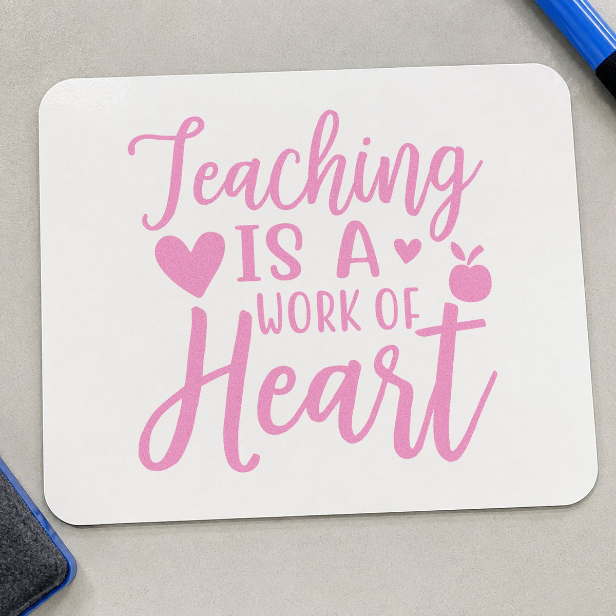 Teaching Is Work Of Heart craft stamp in purple ink on cardstock, an easy option for gallery show tags.