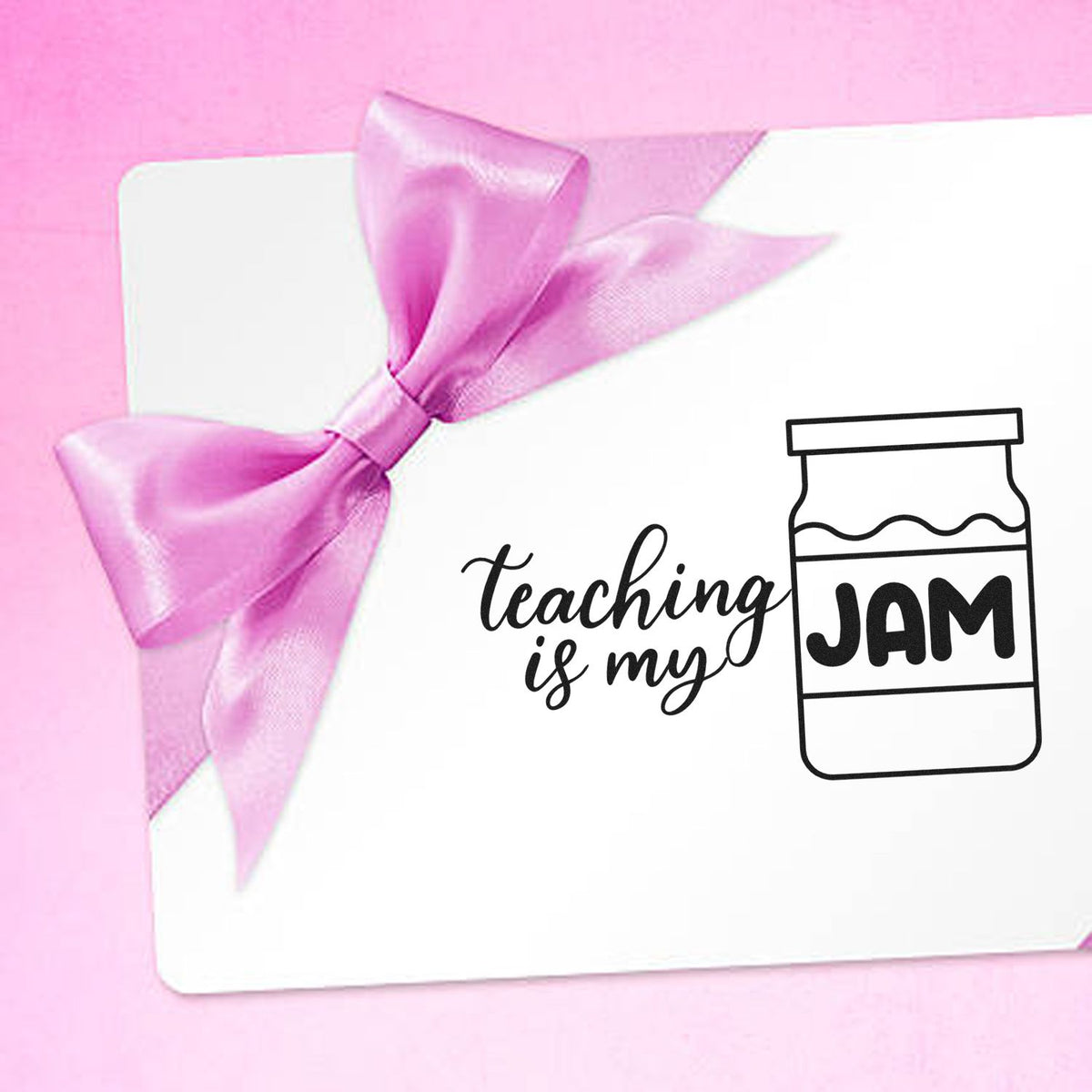 Pink ribbon stamp and seal design with teaching is my jam text and jam jar icon on a white card.