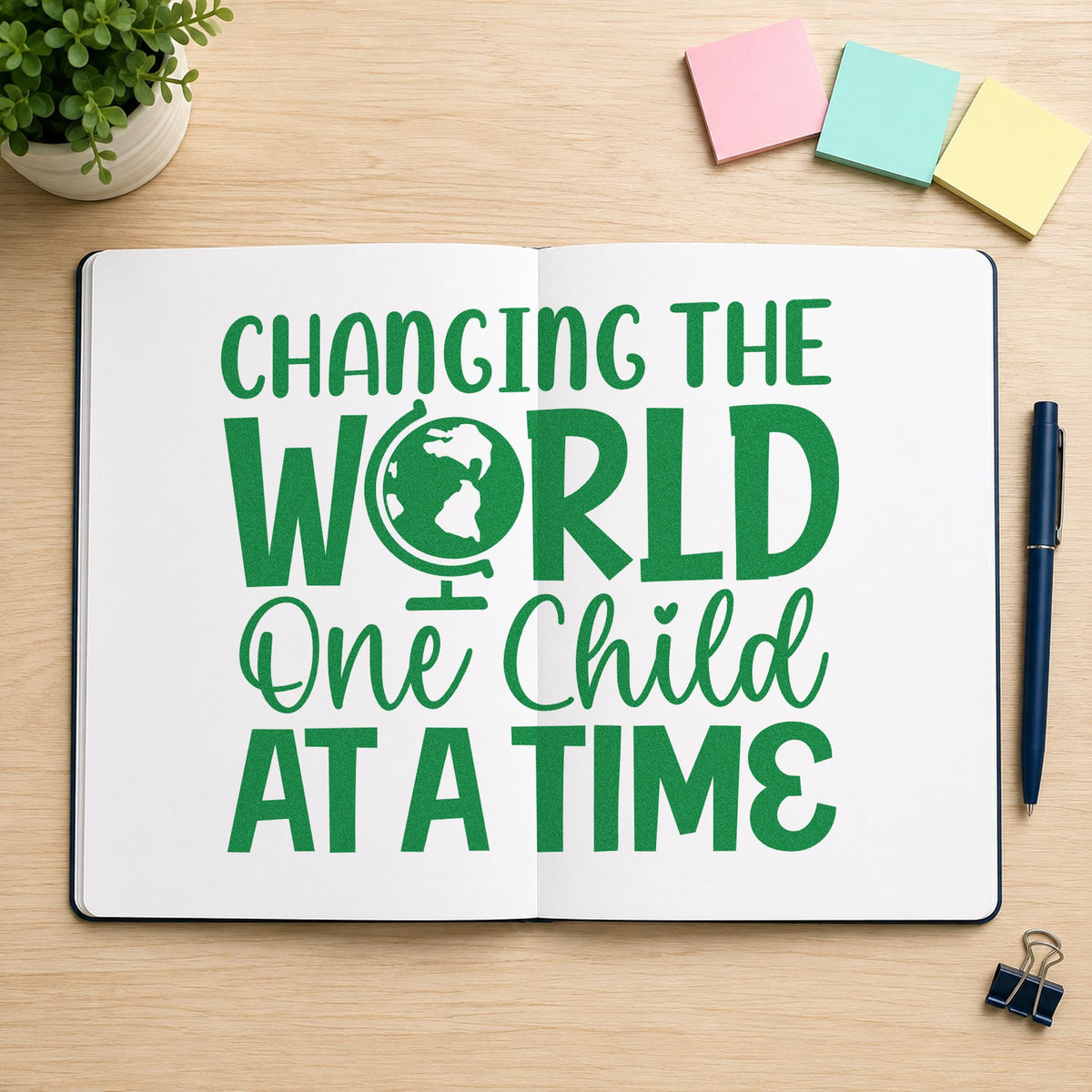 Changing World One Child craft stamp imprint in green ink on a handmade project, one idea being pledge form pages.