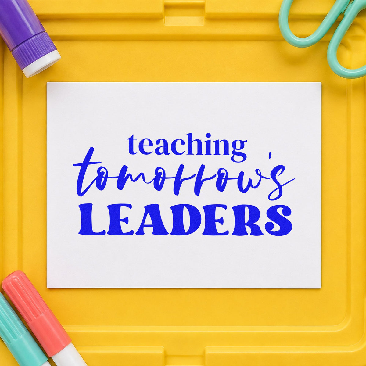 Teaching Tomorrow's Leaders craft stamp in blue ink on cardstock, an easy option for polo collar panels.