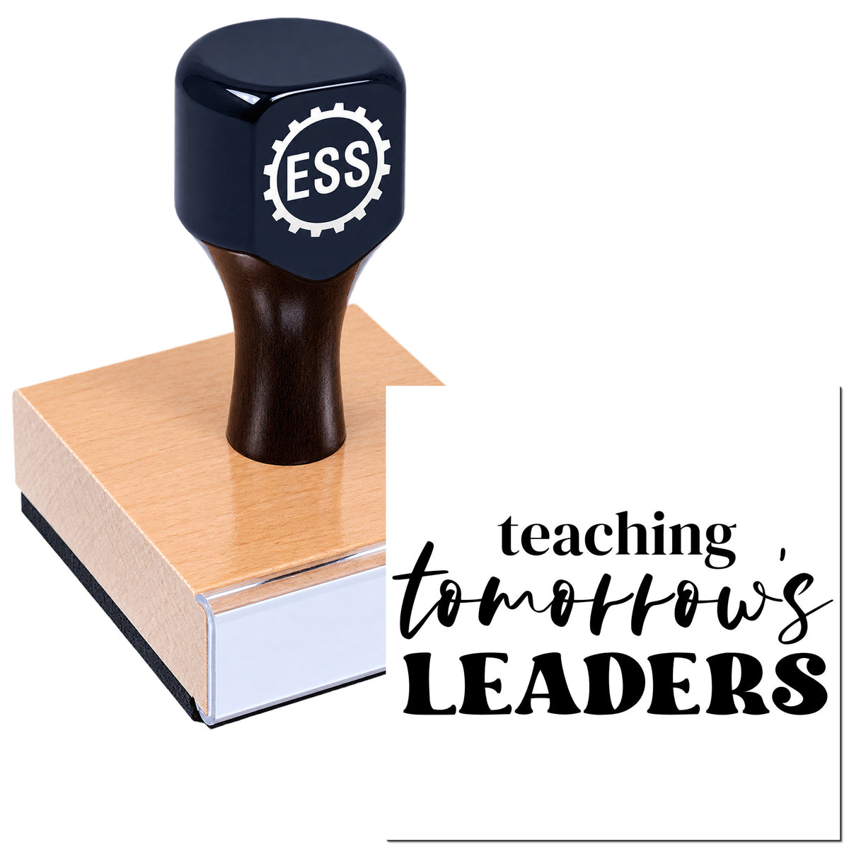 Dark navy ESS stamp and seal on a pink wooden base with "teaching tomorrow's LEADERS" text