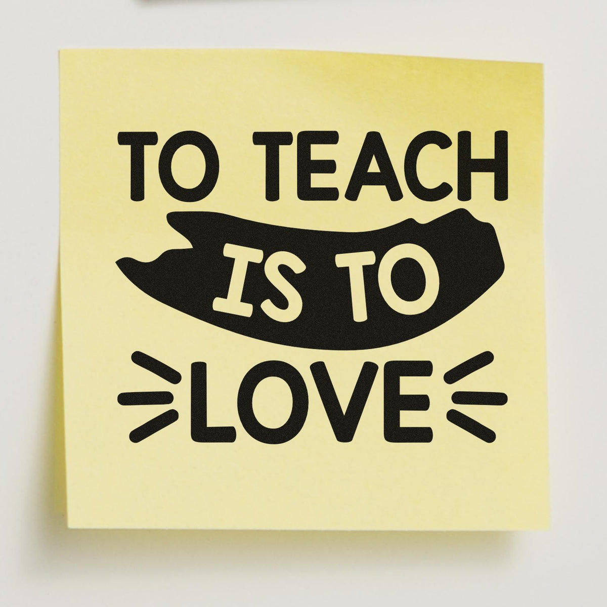 Yellow stamp seal with black TO TEACH IS TO LOVE text and abstract black graphic.