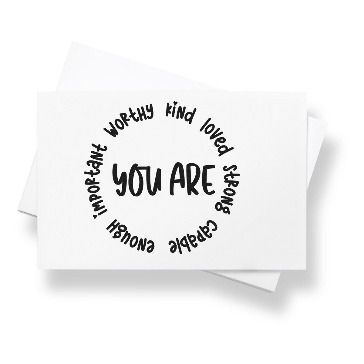 Black motivational stamp and seal design on white card, reading You are with worthy, kind, loved, strong, capable, enough, important.