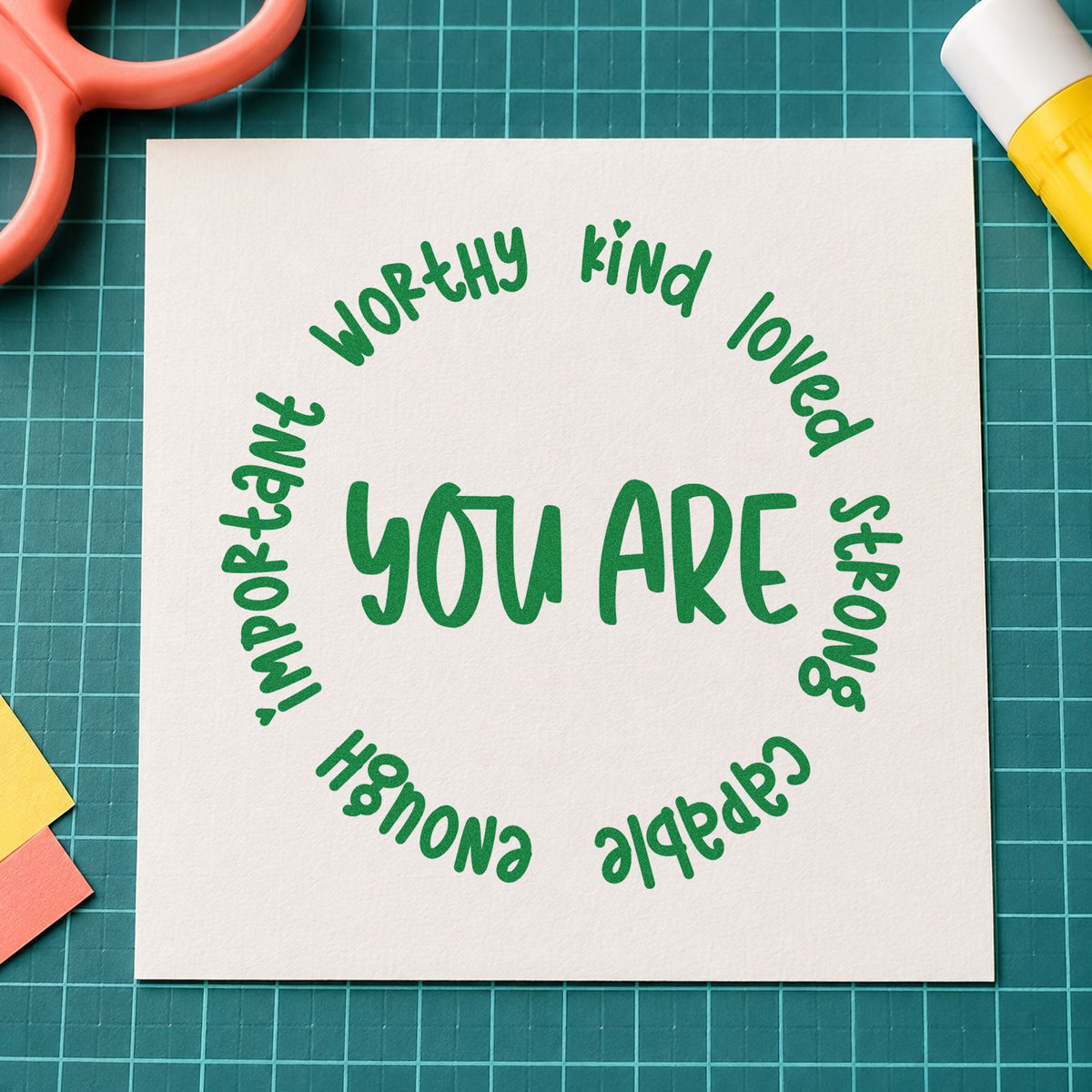 You Are Positive Qualities craft stamp imprint in green ink on a handmade project, one idea being affirmation pages.