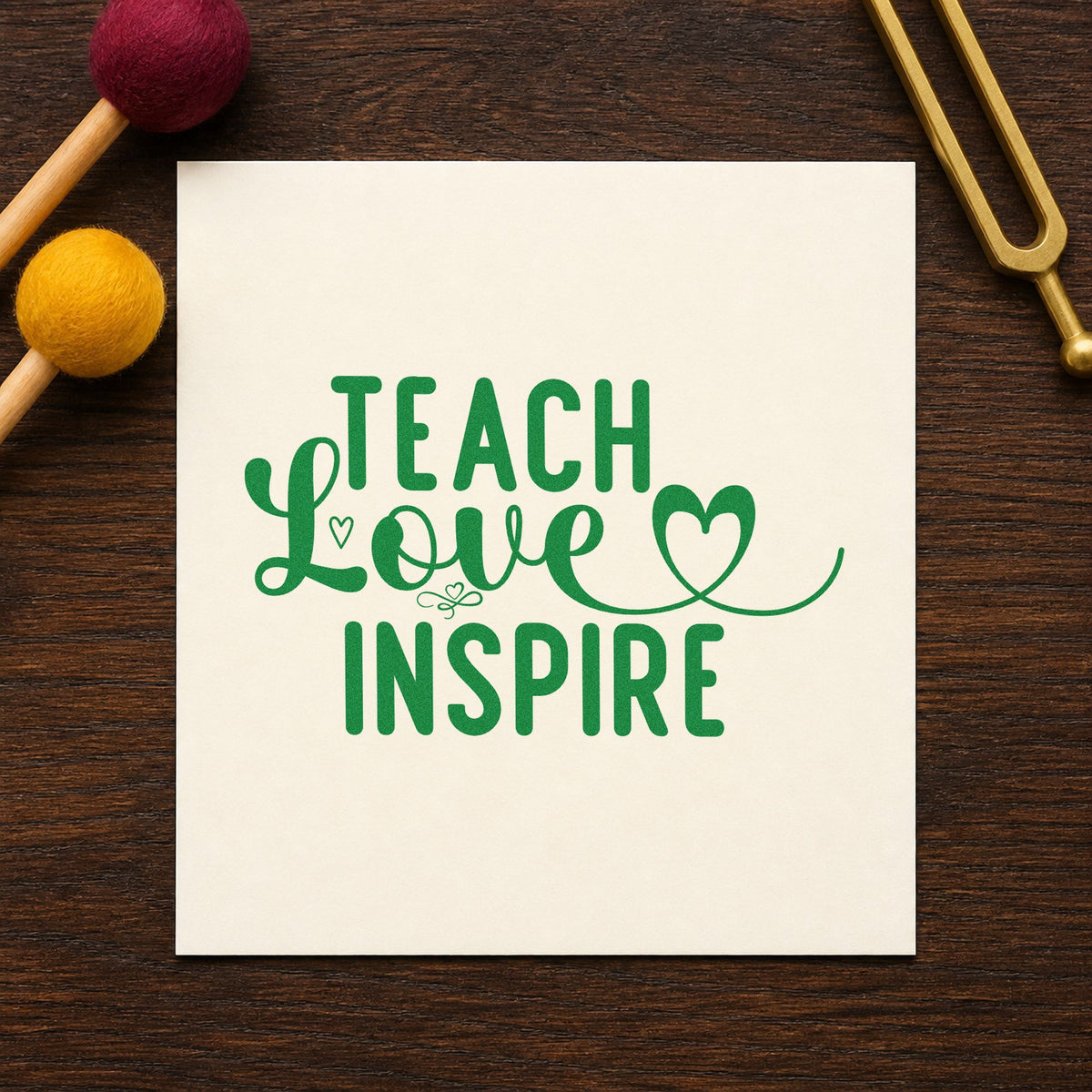 Teach Love Inspire Heart Flourish craft stamp imprint in green ink on a handmade project, one idea being love letter pages.