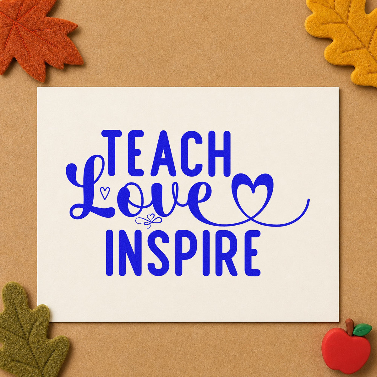 Teach Love Inspire Heart Flourish craft stamp imprinted in blue ink on paper, a design suited to envelope wax seals.