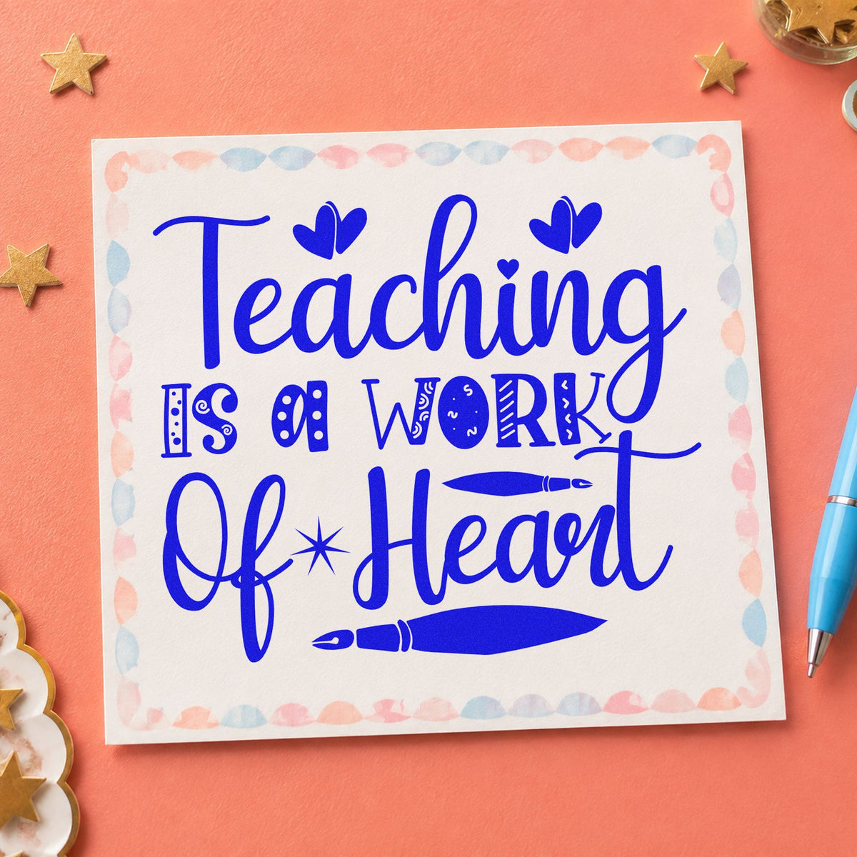 Teaching Work Of Heart Pens craft stamp in blue ink on cardstock, an easy option for blotter cloth panels.