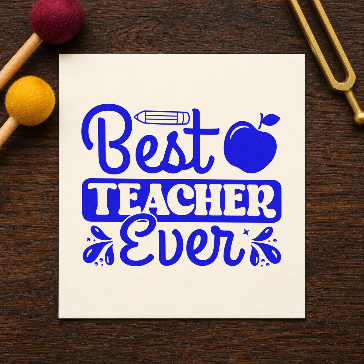 Best Teacher Ever Apple craft stamp in blue ink on cardstock, an easy option for gown trim panels.