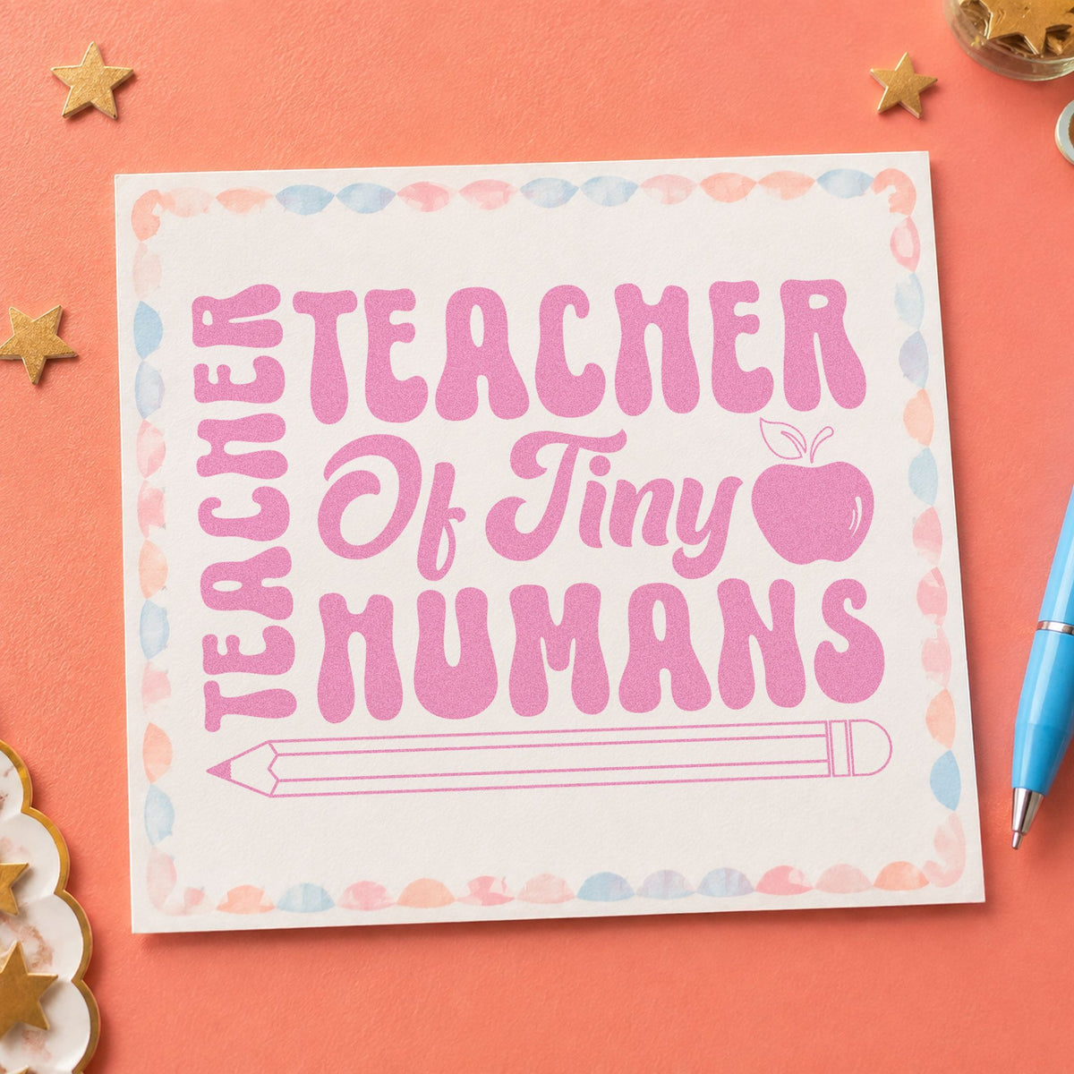 Teacher Of Tiny Humans Pencil craft stamp in purple ink on cardstock, an easy option for key person tags.