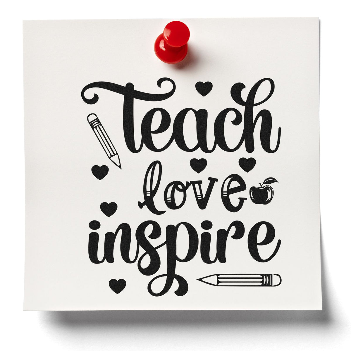 Black teacher stamp/seal design reading Teach love inspire, with hearts and pencils, pinned to white paper with a red pushpin.