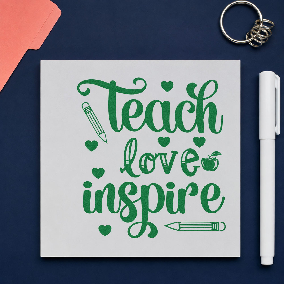 Teach Love Inspire Hearts craft stamp imprint in green ink on a handmade project, one idea being checklist pages.