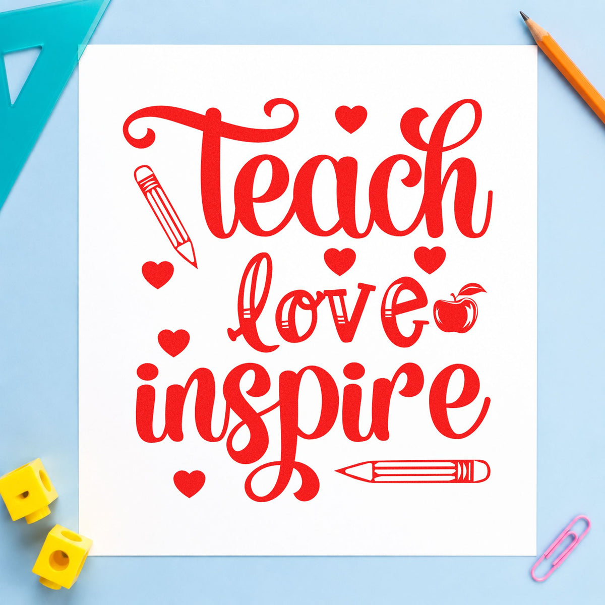 Teach Love Inspire Hearts rubber stamp shown in red ink, stamped for projects such as first post notes.