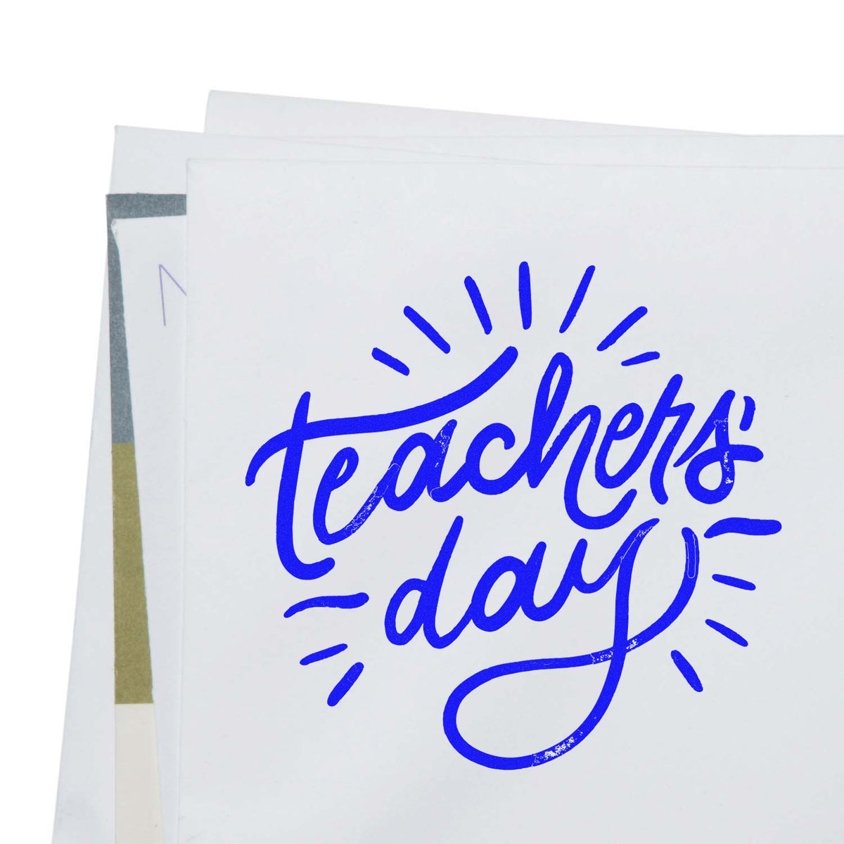 Blue Teachers Day stamp on white seal paper sheets with layered product samples