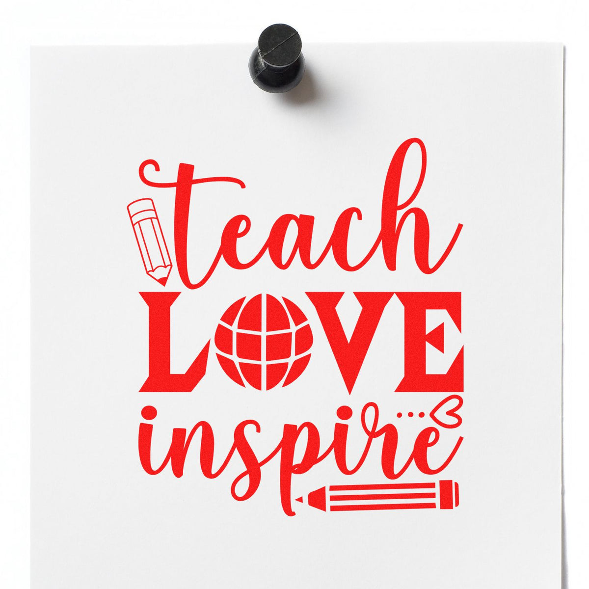 Red teacher stamp design on white paper with pencil and globe icons, pinned by a black rubber stamp.
