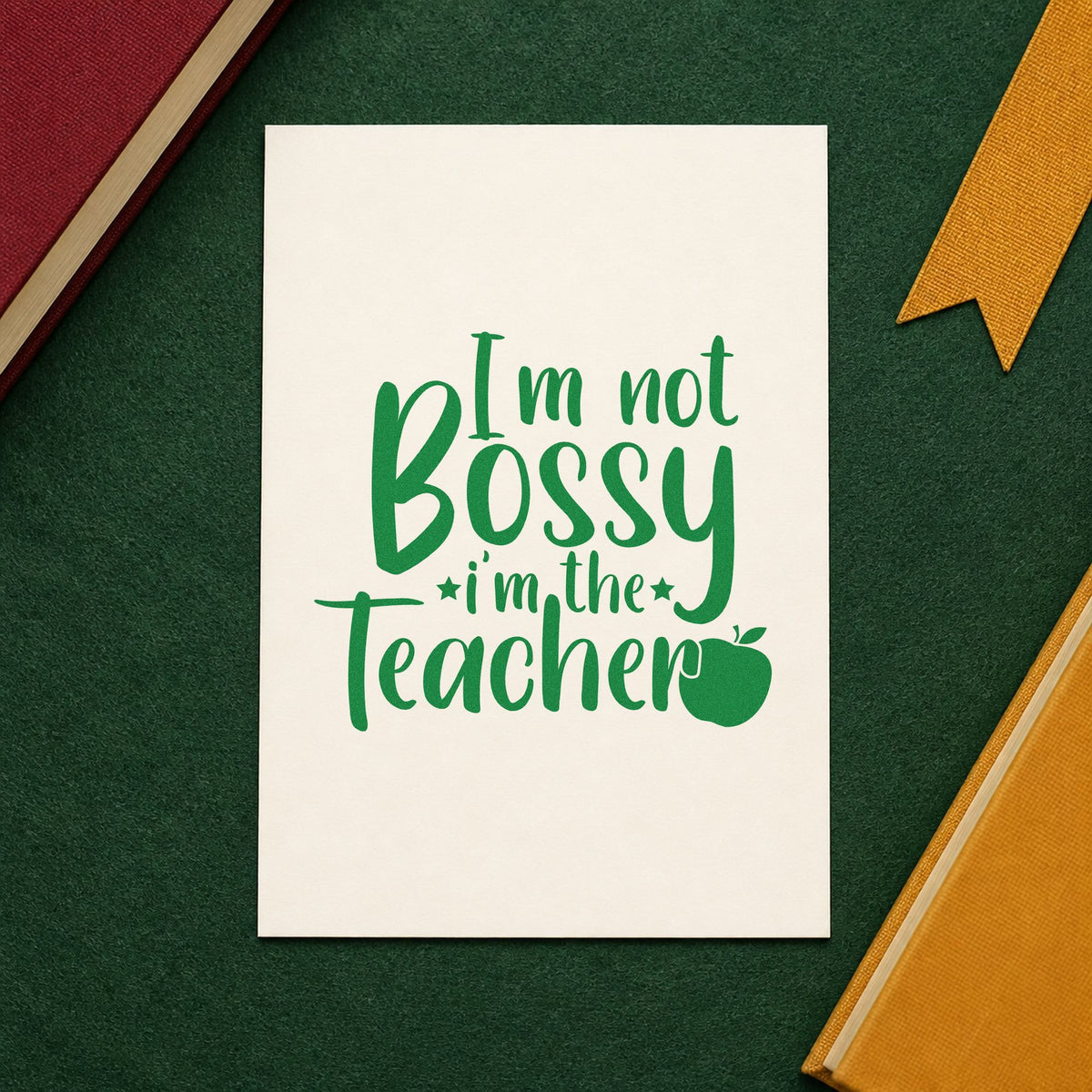 Not Bossy I'm The Teacher craft stamp imprint in green ink on a handmade project, one idea being instruction pages.
