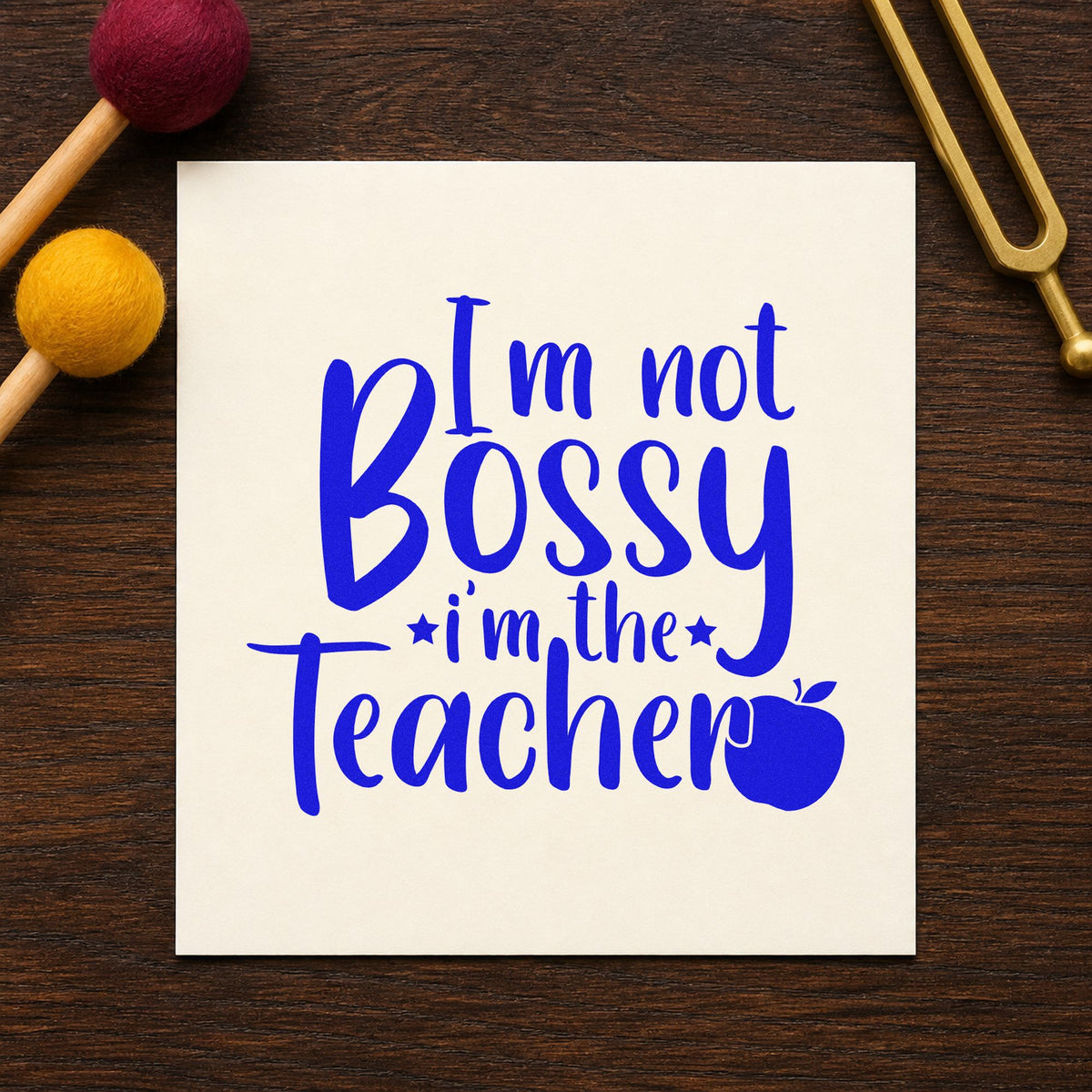 Not Bossy I'm The Teacher craft stamp in blue ink on cardstock, an easy option for whistle loop panels.