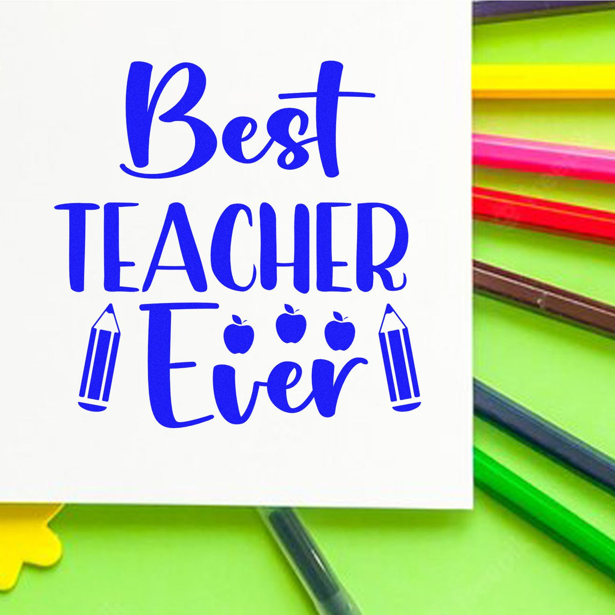 Blue Best Teacher Ever stamp seal design with pencil and apple icons on white, surrounded by colorful pencils.