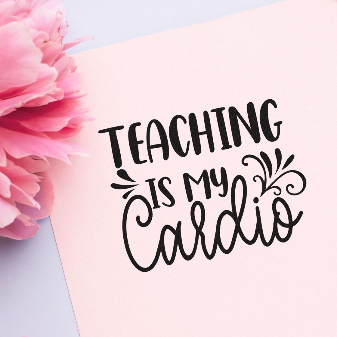 Pink stamp and seal design with black Teaching Is My Cardio lettering and floral accents.