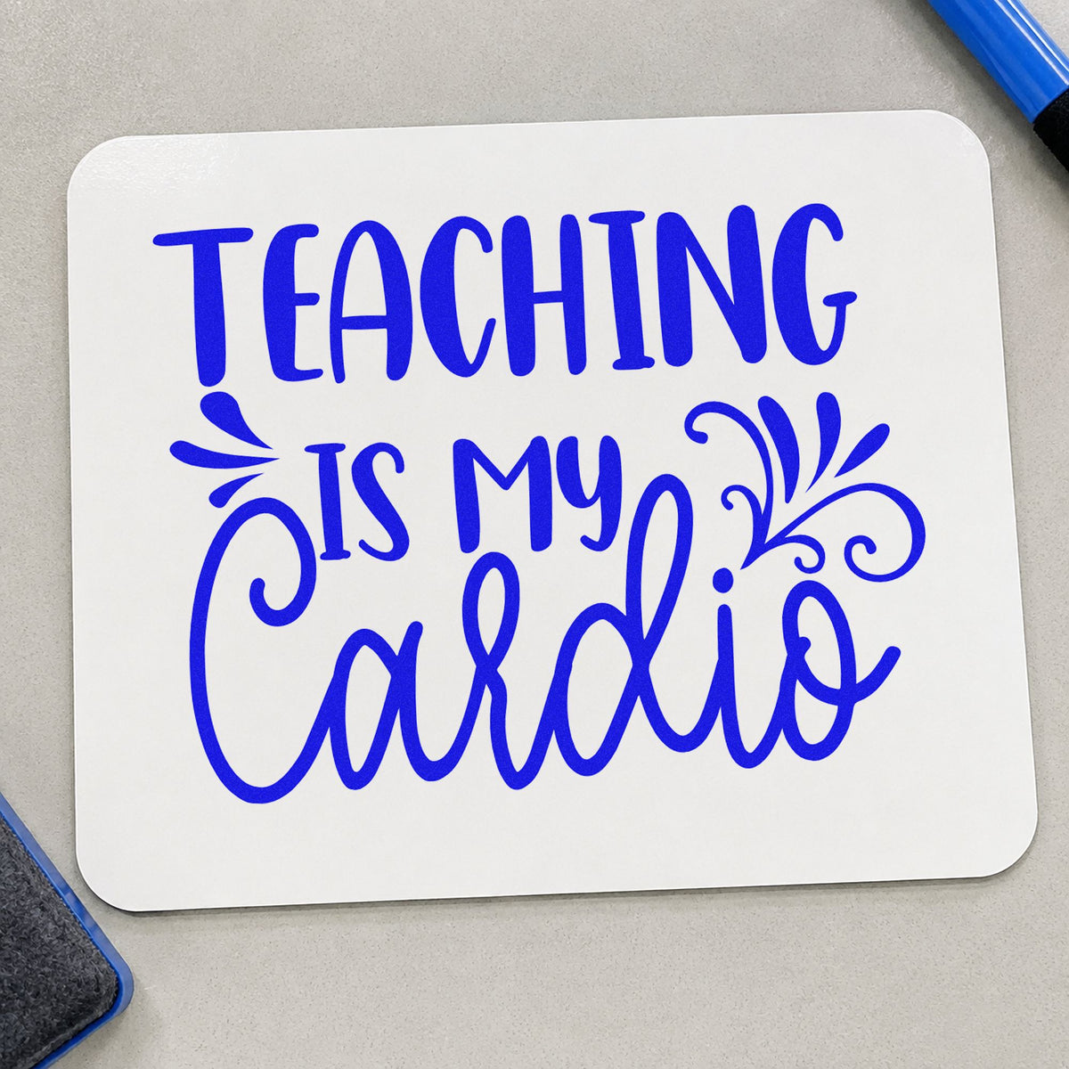 Teaching Is My Cardio Flourishes craft stamp in blue ink on cardstock, an easy option for race bib panels.